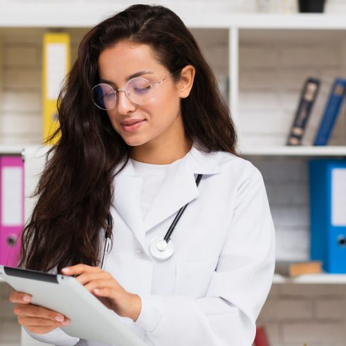 Doctor consulting patient with medical documents
